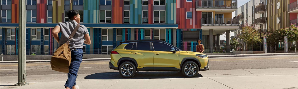 Young man running towards a Collora cross